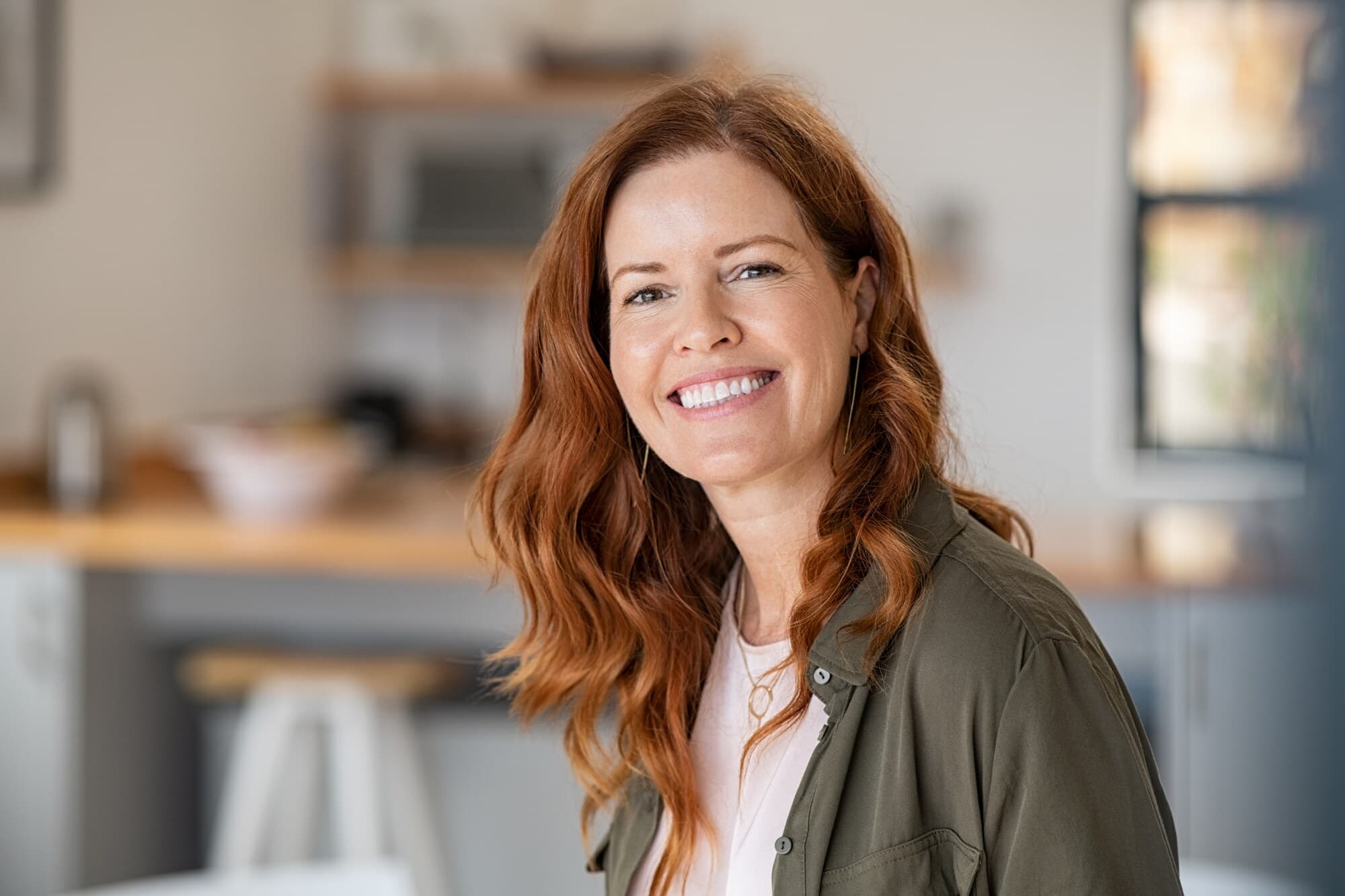 A happy patient smiling after affordable dental care at Oasis Smile Dental